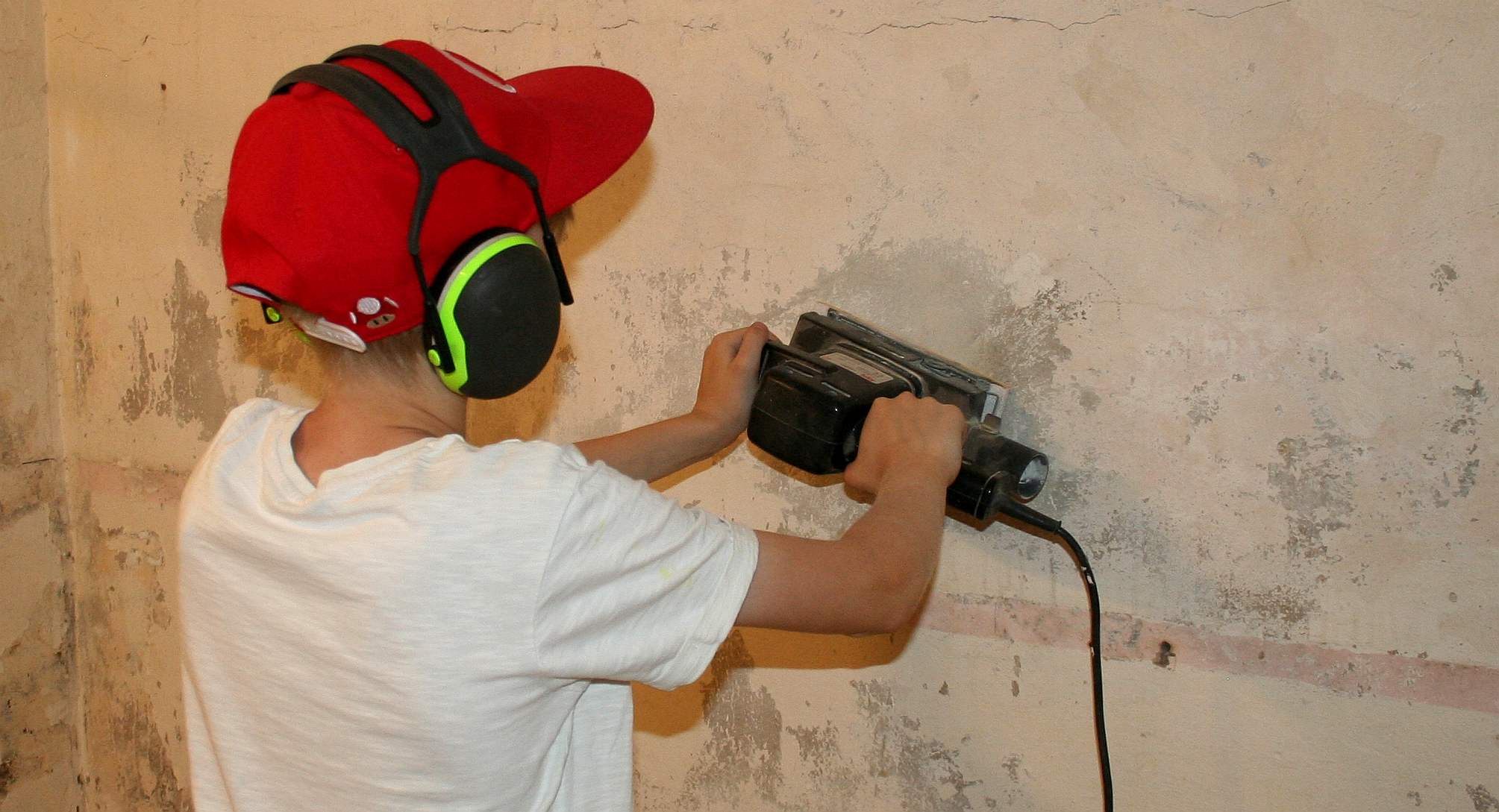 Ryan Dusart sanding down the walls of our marine biology laboratory