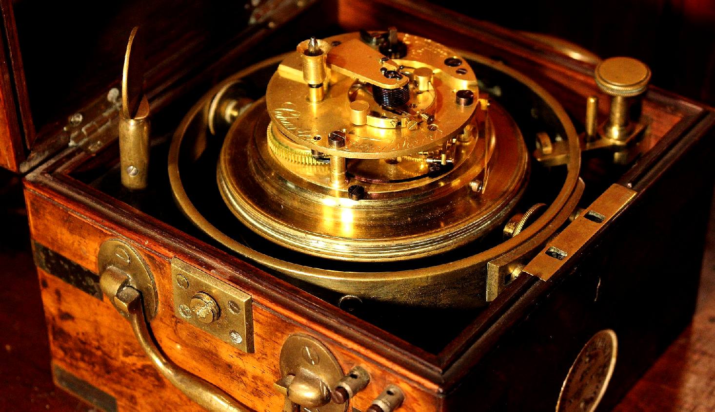 A brass marine chronometer in a beautiful wooden box