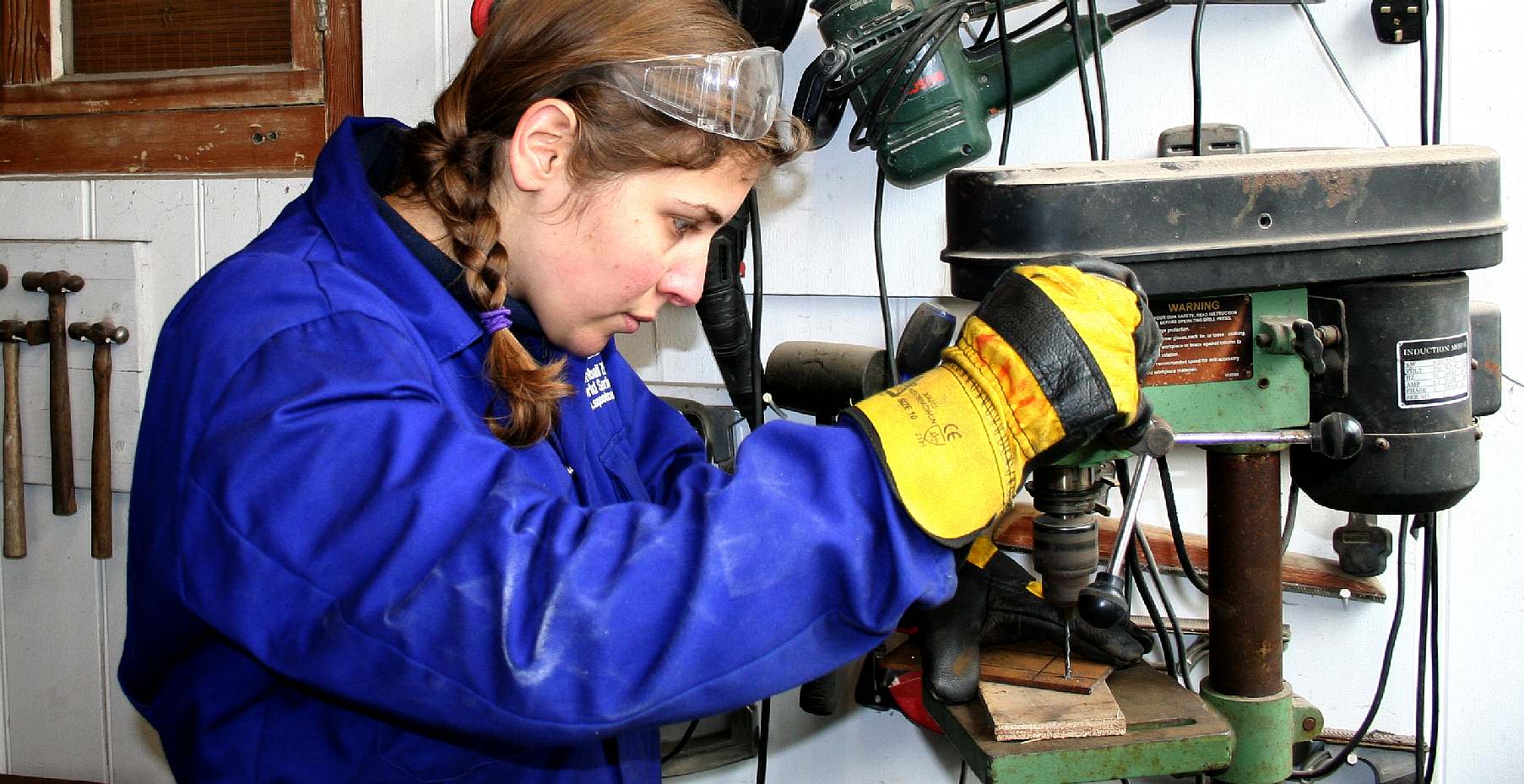 Lolita D'Ortona drilling bolt holes in steel plate